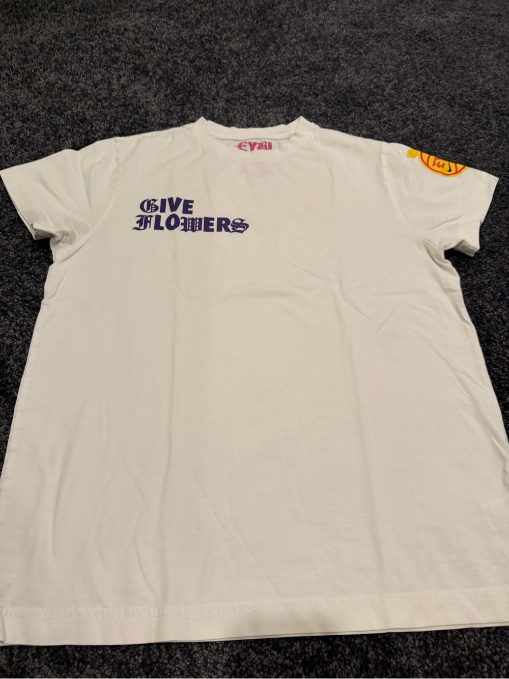 Nike White Short Sleeve Tee with Purple "Give Flowers" Print